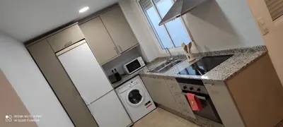 an overhead view of a kitchen with a washing machine at TU CASA en Benetússer , VALENCIA in Benetúser