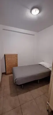a bedroom with a bed in a room at TU CASA en Benetússer , VALENCIA in Benetúser