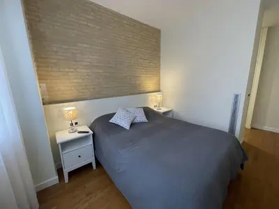a bedroom with a bed and two night stands at Luxury double Suite at heart of Ruzafa in Valencia