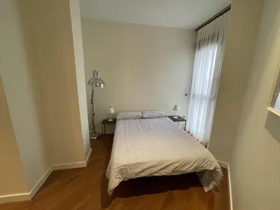 a bedroom with a bed and a window at Luxury double Suite at heart of Ruzafa in Valencia