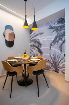a dining room with a table and chairs at Neobeds - Stylish modern 1BR Apt Near Old Town & Steps from Turia Park in Valencia