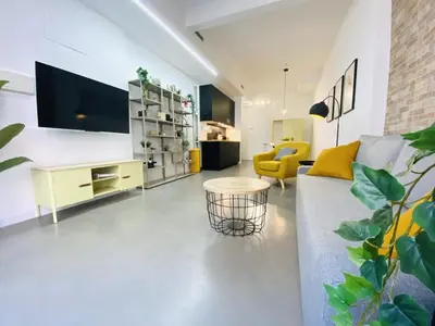 a living room with a couch and a table at Tarongers, lovely flat in the center in Valencia