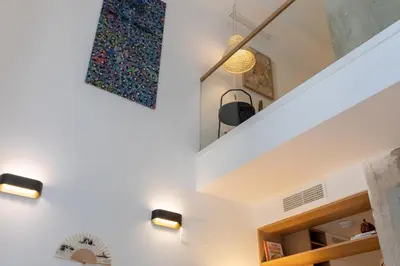 a staircase in a house with two lights on it at ApartUP Opera Loft Love in Valencia