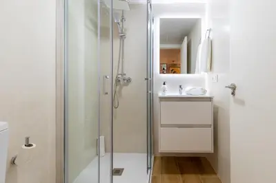 a bathroom with a shower and a sink at ApartUP Opera Loft Love in Valencia
