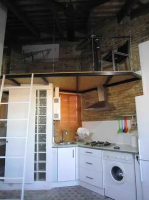a kitchen with a sink and a stove top oven at Young Penthouse in Valencia