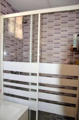 a bathroom with a shower with a glass door at Double cozy room. Ruzafa - perfect place to stay in Valencia