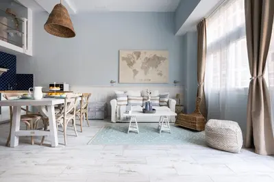 a living room with a couch and a table at Le Méditarranéen de COUP DE COEUR APPARTEMENTS in Valencia
