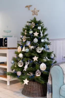 a christmas tree with christmas ornaments on it at Le Méditarranéen de COUP DE COEUR APPARTEMENTS in Valencia