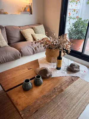 a coffee table in a living room with a couch at ruralhome callemayor in Altura