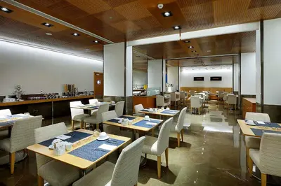 a dining room with tables and chairs in a restaurant at Eurostars Gran Valencia in Valencia