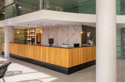 a lobby with a reception desk in a building at Eurostars Acteón in Valencia