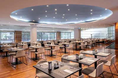a large dining room with tables and chairs at Eurostars Acteón in Valencia