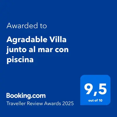 a screenshot of a cell phone with the text awarded to arabic villa at Agradable Villa junto al mar con piscina in Sagunto