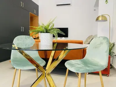 a dining room with a glass table and two chairs at RUBEN VELA - LOFT CLOSE to RUSSAFA (SOHO) in Valencia