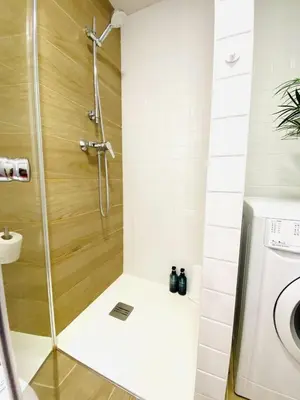 a shower with a glass door in a bathroom at RUBEN VELA - LOFT CLOSE to RUSSAFA (SOHO) in Valencia