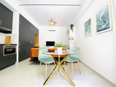 a dining room with a table and two chairs at RUBEN VELA - LOFT CLOSE to RUSSAFA (SOHO) in Valencia