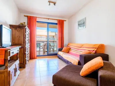 a living room with a couch and a tv at Apartment Las Dunas by Interhome in Moncófar