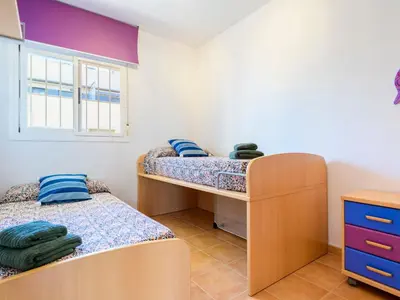 a bedroom with two bunk beds and a window at Apartment Las Dunas by Interhome in Moncófar