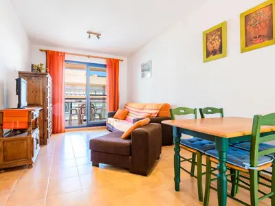 a living room with a table and a couch at Apartment Las Dunas by Interhome in Moncófar