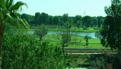 a view of a park with a bridge and a lake at Ad Hoc Parque in Bétera