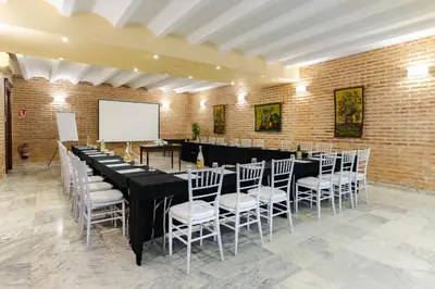 a conference room with a long table and chairs at Ad Hoc Parque in Bétera