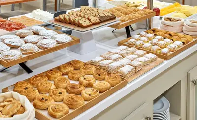 a bakery filled with lots of different types of pastries at NH Valencia Las Ciencias in Valencia