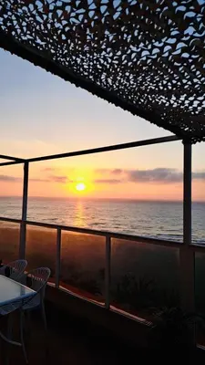 a sunset from the balcony of a cruise ship at Lux Penthouse Mediterranean views Beach front in Puerto de Sagunto
