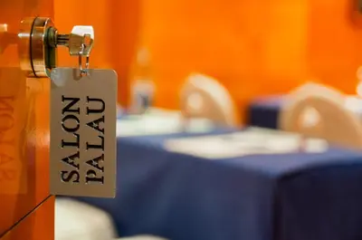 a door with a tag on it in front of a table at Hotel Villacarlos in Valencia
