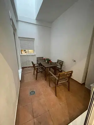 a dining room with a table and chairs and a window at UIM Mediterraneo PB Libertad Wifi in Puerto de Sagunto
