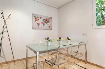 a table with three potted plants on it in a room at PENTHOUSE on the BEACH in Valencia