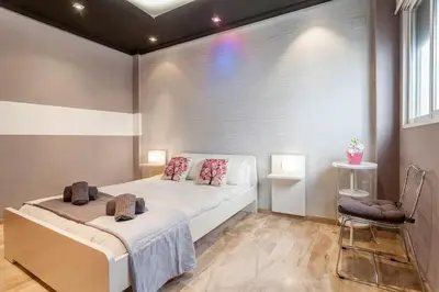 a bedroom with a large bed and a window at PENTHOUSE on the BEACH in Valencia