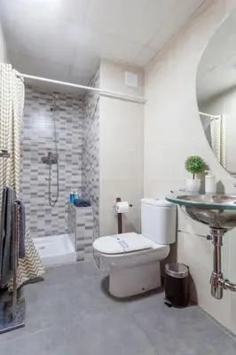 a bathroom with a toilet and a sink and a shower at PENTHOUSE on the BEACH in Valencia