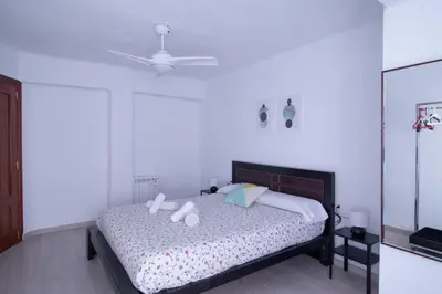 a bedroom with a bed with two pillows on it at Marina Flat by Concept Flats in Valencia