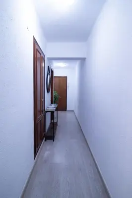 an empty hallway with a door and a table at Marina Flat by Concept Flats in Valencia