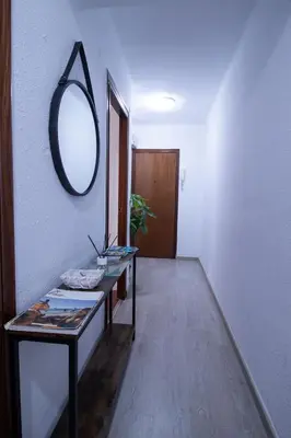 a room with a table and a mirror on the wall at Marina Flat by Concept Flats in Valencia