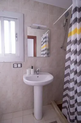 a bathroom with a sink and a mirror at Marina Flat by Concept Flats in Valencia
