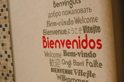 a hotel room with two beds and a writing on the wall at Hotel Mas Camarena in Paterna