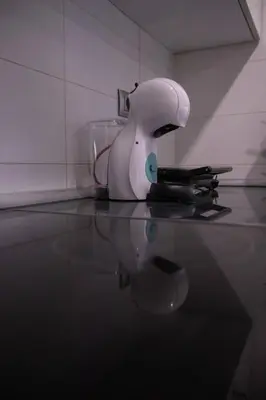 a white hair dryer sitting on top of a counter at Old Town Flat by Concept Flats in Valencia