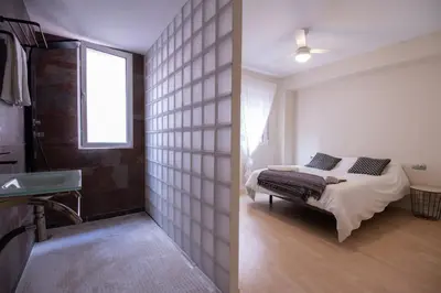 a bedroom with a bed and a window in it at Old Town Flat by Concept Flats in Valencia