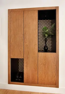a wooden cabinet with a potted plant in it at One Shot Reina Victoria in Valencia