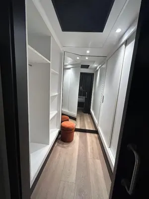 a hallway with white shelving in a room at Hotel Dimar in Valencia