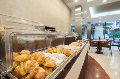 a bakery filled with lots of pastries on display at Hotel RH Sorolla Centro in Valencia