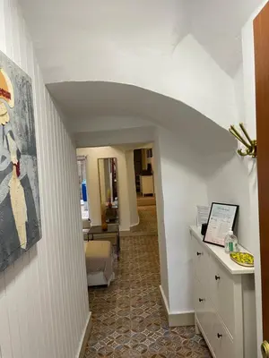 a hallway with an archway in a house at Lovely Coquette loft, heart of cuitat vella El Carmen Valencia in Valencia