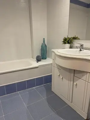 a bathroom with a sink and a bath tub and a sink at UIM Mediterraneo Claveles Wifi in Puerto de Sagunto