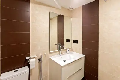 a bathroom with a sink and a mirror at Loft Nou Benicalap - Housevanlive in Valencia