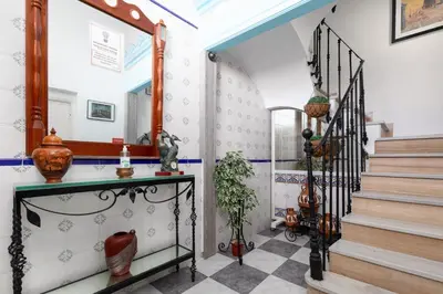 a hallway with stairs and a mirror on the wall at Malvarrosa Las Arenas I in Valencia