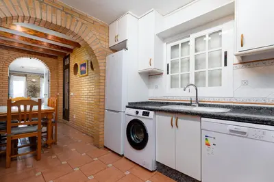a kitchen with a sink and a dishwasher at Malvarrosa Las Arenas I in Valencia