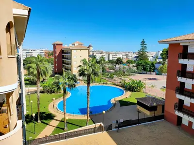 a view of a swimming pool from a building at Global Vacacional, Apartamento con gran terraza y piscina in Canet de Berenguer