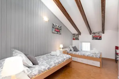 a bedroom with two beds in a room at Malvarrosa Las Arenas II in Valencia