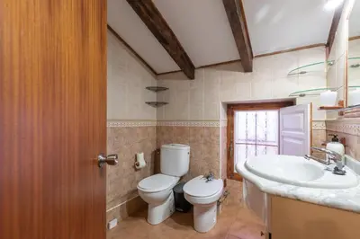a bathroom with a toilet and a sink at Malvarrosa Las Arenas II in Valencia